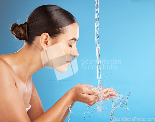 Image of Woman, hands and water for skincare hydration, hygiene or face wash against a blue background. Beautiful female in facial cleaning, washing or cleansing for skin rehydration or dermatology on mockup