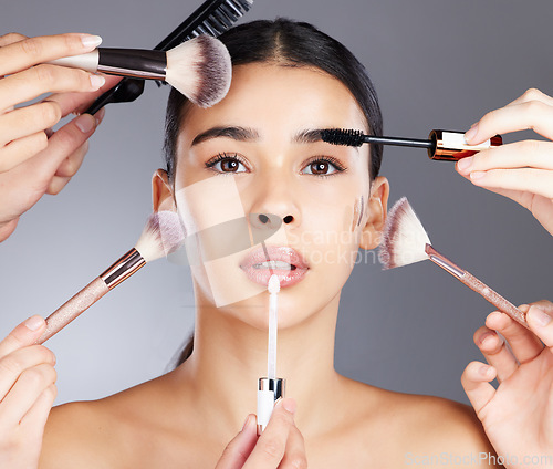 Image of Woman, hands and portrait with makeup tools for beauty, skincare wellness and cosmetics dermatology. Model, facial glow and application brush for self care and luxury salon product vision in studio