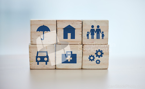 Image of Wooden, cubes or stack in house risk management, security or future protect on background desk mockup or home table. Zoom, building blocks or life insurance in medical, car loan or mock up cog wheel
