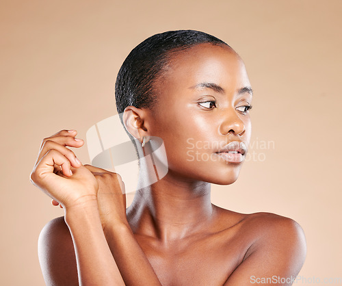 Image of Beauty, wellness and face of black woman in studio to promote luxury treatment, cosmetics and makeup. Spa aesthetic, skincare and female model on brown background for facial, shine and glowing skin