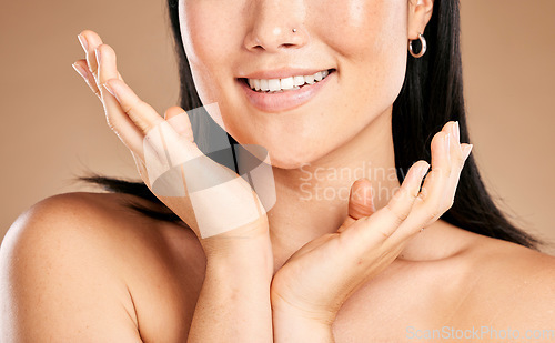 Image of Mouth, skincare or happy woman with hands by face in grooming routine isolated on studio background. Wellness, relaxing or beautiful girl model smiles in luxury facial, self care or beauty treatment