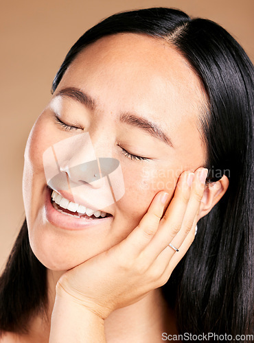 Image of Beauty, skincare or woman with a happy smile on her face in grooming routine isolated on studio background. Tokyo, relaxed or beautiful Japanese girl model in luxury facial treatment for self care