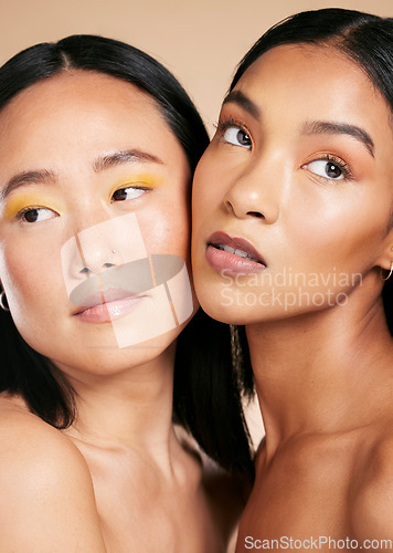 Image of Makeup, beauty and face with skincare glow for diversity of skin and cosmetic self care. Magazine, dermatology and spa treatment for friends or models isolated against a brown studio background