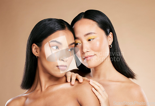 Image of Love of friends or women for skincare, makeup and cosmetics with diversity and inclusion in studio. Asian and black person for skin glow, spa facial and color on face with dermatology product