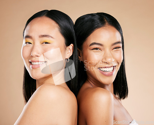 Image of Portrait, makeup and diversity with model woman friends in studio on a beige background for skincare. Face, skin and wellness with a young female and friend posing to promote a cosmetic product