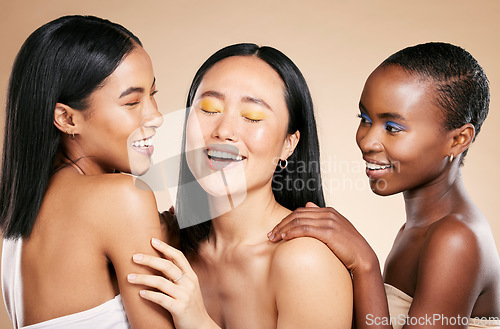 Image of Happy, friends and beauty in studio for wellness, hygiene and creative grooming on brown background. Smile, women and eyeshadow by girl with different, skin and luxury skincare, relax and isolated