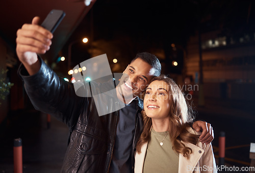 Image of Couple of friends, phone or night selfie on city street or road for social media, profile picture or birthday celebration vlog. Smile, happy or influencer people bonding in dark while live streaming