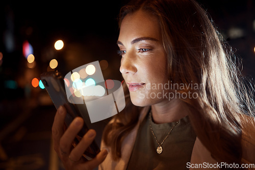 Image of Woman, face or phone in night city, road or street for social media, taxi call or cab searching in London urban location. Student, tourist or person on mobile communication technology in dark travel