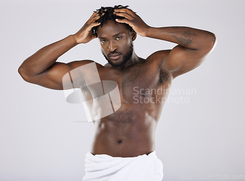 Image of Muscular, portrait and black man with cosmetics, skincare and confident guy on grey studio background. African American male, body builder or person with muscles, torso or dermatology for smooth skin
