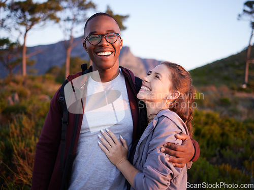 Image of Smile, nature and portrait of interracial couple on mountain for holiday, vacation and hiking adventure on weekend. Travel, dating and happy man hugging woman enjoy calm, outdoor freedom and peace