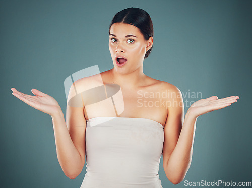 Image of Woman, shocked face portrait and hands for surprise, announcement or excited isolated in studio background. Young female, scared facial expression and shock mouth with wow amazed hands gesture