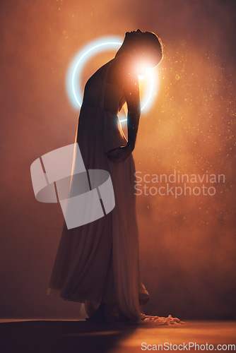 Image of Neon circle, silhouette and woman in orange lighting for creative fashion, art deco and beauty. Ballet dancer, glowing aesthetic and shadow of girl pose for dream, fantasy and theatre on stage