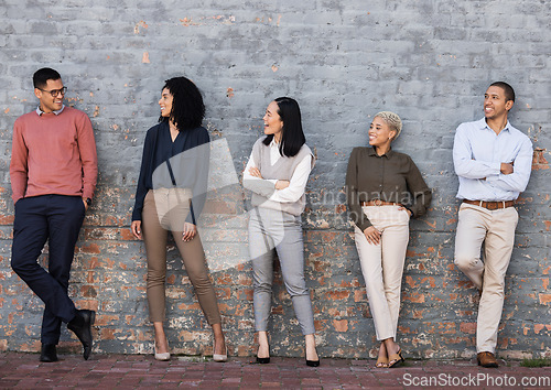 Image of Diversity, smile and team standing at wall at creative startup company waiting for recruitment. Human resources, job opportunity and group of happy hr employees in row, business people stand together