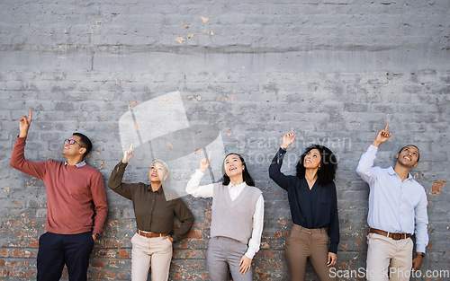 Image of Diversity, wall and happy business people pointing at mockup space, marketing mock up or advertising. Collaboration, teamwork or row of company employee group with hand gesture for hiring recruitment