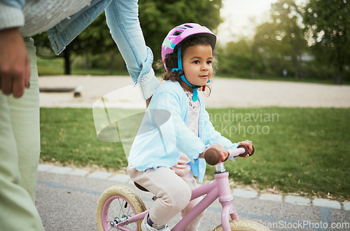 Image of Mother, girl and learning with bike in street, road or park for love, bonding and happy on holiday. Mom, kid and teaching, cycling and bicycle on adventure, outdoor or neighborhood for development
