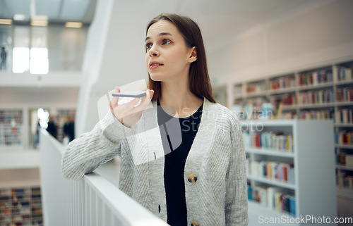 Image of Phone, communication and student woman in a library education and learning building talking. Books, girl talking and research conversation of a person in college ready for study and book search