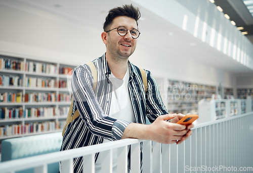 Image of Library, smart student or intelligent man with phd research goals, vision for success and excited for knowledge learning. University, campus or college people thinking of books in education and study