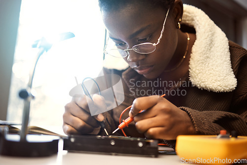 Image of University student, engineering and electronics with black woman learning on electrical project. Education, engineer or technician with technology voltage test for electricity and innovation in class