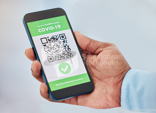 Image of Covid, vaccination and mobile certificate for travel, trip or medical certification on a phone. Technology, healthcare and closeup of hand with app for coronavirus with barcode for immunity vaccine.