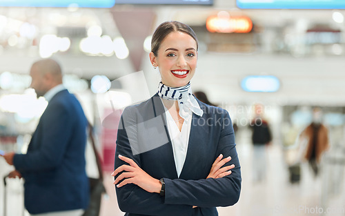 Image of Airport, woman concierge and portrait with smile, arms crossed and vision for career in international travel. Customer service, transport service expert and happy for job with motivation at workplace