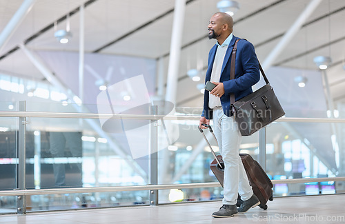 Image of Corporate, black man in airport and travel for conference, workshop and ceo with happiness and tourism. Nigerian male, entrepreneur and leader commute, abroad destination and employee with luggage