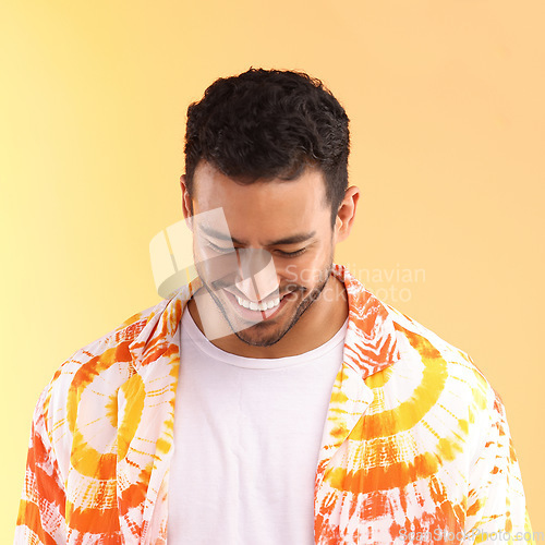 Image of Happy hipster man, studio and tie dye fashion shirt with smile, excited and relax by yellow background. Gen z model, clothes and summer style with happiness, color and natural aesthetic by backdrop