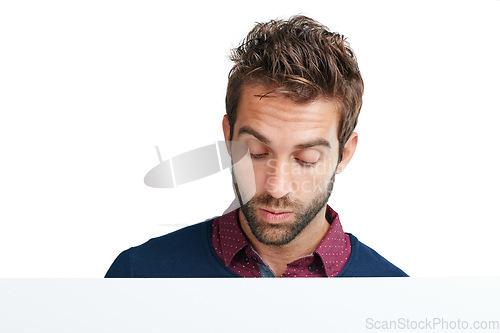 Image of Face, thinking and mockup with a man in studio isolated on a white background for branding or product placement. Idea, mock up and curious with a handsome young male on blank advertising space