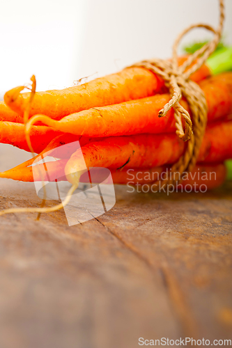 Image of baby carrots bunch tied with rope