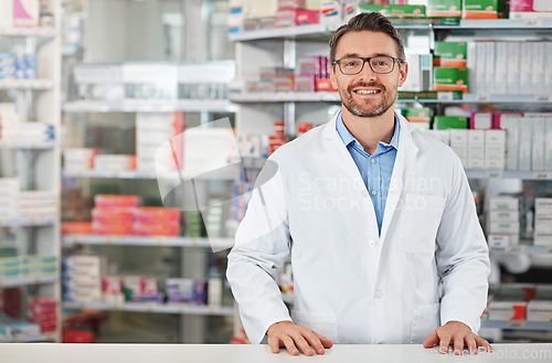 Image of Pharmacy, portrait and pharmacist man smile for medicine, product on shelf and healthcare industry help desk. Trust, expert and medical professional worker for supplements, pills or drugs management