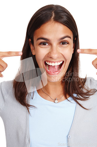 Image of Portrait, wow and surprise with a woman in studio isolated on a white background pointing to her head. Face, omg and shock with an attractive young female saying wtf closeup on blank space