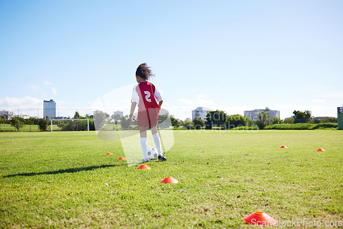 Image of Soccer, mockup or sports and a girl training alone with a ball on a field for practice or skill. Fitness, football and grass with a kid running or dribbling on a pitch for competition or exercise