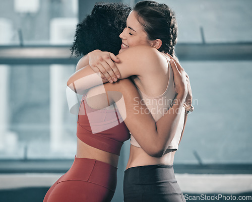 Image of Fitness, friends and hug with women in gym for happy, exercise and workout. Well done, congratulations and support with girl athlete training together for sports, mindset and wellness motivation