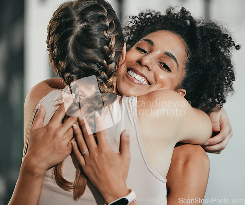 Image of Happy, friends and hug with women in gym for for fitness, exercise and workout. Well done, congratulations and support with girl athlete training together for sports, mindset and wellness motivation