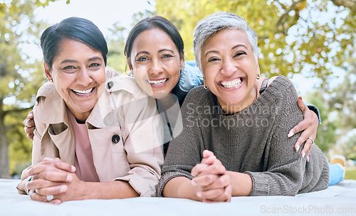 Image of Portrait, family and sisters in a park with group of people, happy and laughing looking relax. Friends, senior ladies and women enjoying a picnic with together in spring, cheerful and excited outdoor