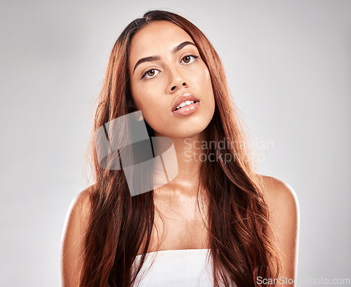 Image of Face, woman and hair with skin in portrait, beauty and hair care with glow and shine isolated on studio background. Hairstyle, cosmetic care and mockup with wellness, keratin treatment and styling