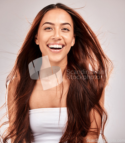 Image of Beauty, hair and wind with portrait of woman for skincare, wellness and makeup cosmetics. Keratin, shampoo and balayage with face of girl for self care, luxury and skincare in studio background