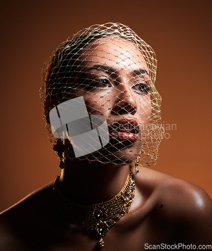 Image of Net veil, classy and face of a woman thinking of fashion isolated on a brown studio background. Elegance, makeup and stylish vintage model with a fancy, retro and glamour accessory on a backdrop