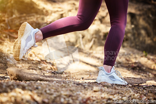 Image of Running, fitness and shoes of woman in nature park for workout, health and cardio training. Wellness, sports and stamina endurance with girl runner jogging in forest for progress goals, exercise