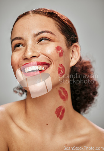 Image of Makeup, red lipstick and kiss on face of woman model in studio for cosmetics, love and happiness. Beauty headshot of person happy for valentines day spa facial skin idea or skincare motivation