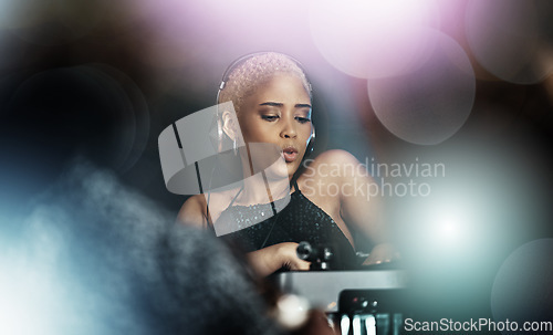 Image of Disco, dj and music of black woman in nightclub for party, event and concert with lights, energy and listening. Rave, retro and person, musician or artist on audio technology for techno in dark room