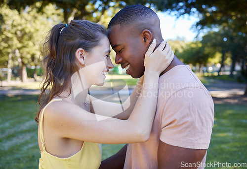 Image of Smile, love and interracial couple at a park date with diversity, summer celebration and valentines day. Race, care and black man with partner or people together in garden happy for picnic with peace
