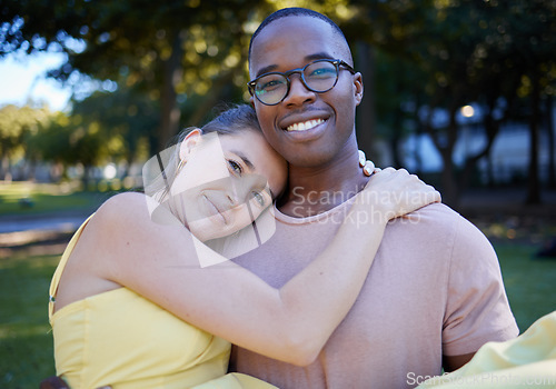 Image of Couple hug in portrait with date outdoor, nature and happy people in interracial relationship with commitment in park. Love, trust and support with black man and woman, smile on face and fresh air