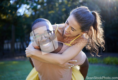 Image of Piggyback, smile and portrait of couple at park in interracial love, nature wellness and support walking in summer. Trees, freedom and happy black man with woman or people having fun together on date