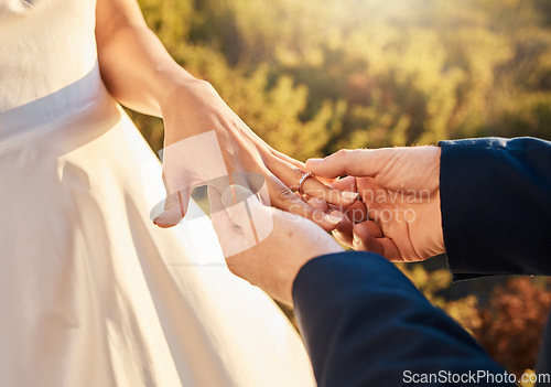 Image of Couple hands, wedding ring and love ceremony outdoor with jewelry and save the date announcement. Engagement, together and marriage of people in nature at commitment and engagement event with faith