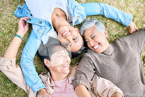 Image of Park, friends relax and top view of women bonding, caring and enjoying quality time together. Peace, freedom and happy group of retired senior females lying on grass talking, chatting and having fun.