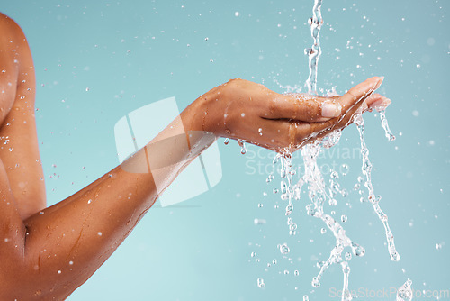 Image of Sustainability, ecology and hand of a woman with water isolated on blue background in a studio. Environment, clean energy and person with a splash to recycle liquid for agriculture change on backdrop