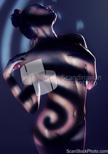 Image of Nude, sexy and silhouette of woman, art and creative aesthetic with beauty and body against studio background. Dark, seductive and art deco with skin, shadow pattern and artistic, sensual and naked.