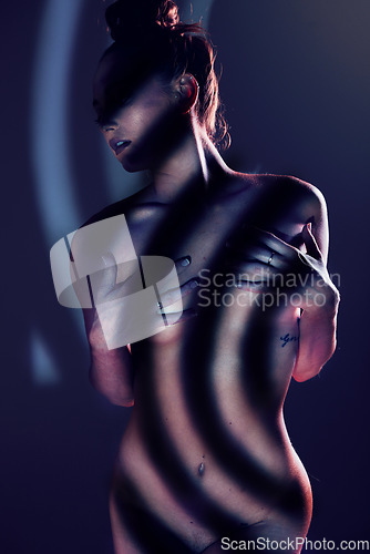 Image of Stripes, beauty and naked woman in studio for sexual desire, erotic art and body wellness on black background. Creative light, fashion and torso silhouette of nude girl in black and white aesthetic