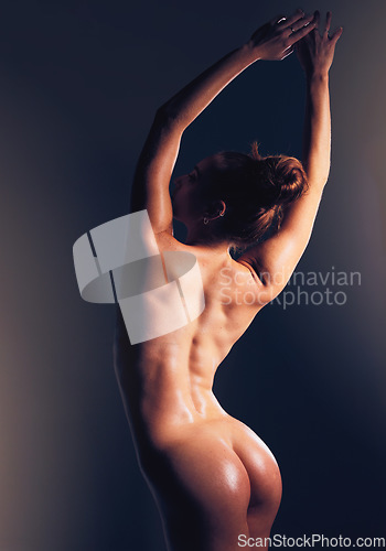 Image of Naked, woman and butt in studio, sexy and dark for sensual beauty, skincare and fitness by backdrop. Model, nude and ass with glow, sexual wellness and erotic aesthetic with body by black background