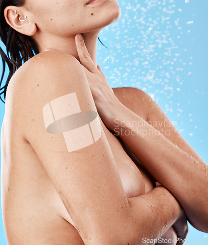 Image of Beauty, body and wellness woman in shower for cleaning, skincare and hygiene wellbeing wash. Relax, health and self care lifestyle of calm girl model washing skin on blue studio background.
